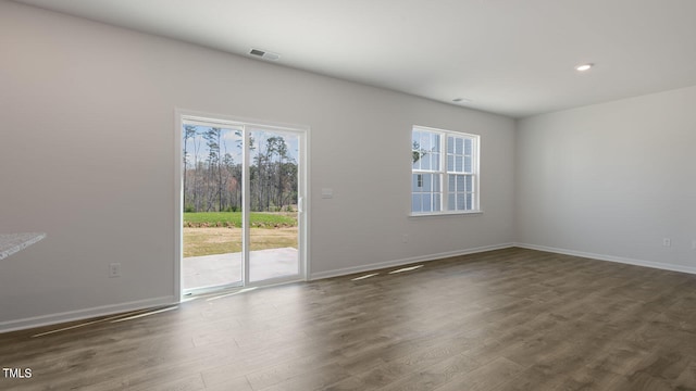 unfurnished room featuring dark wood-type flooring