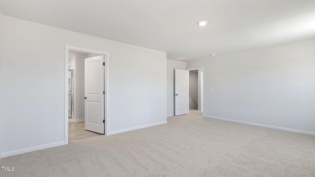 unfurnished bedroom with light carpet