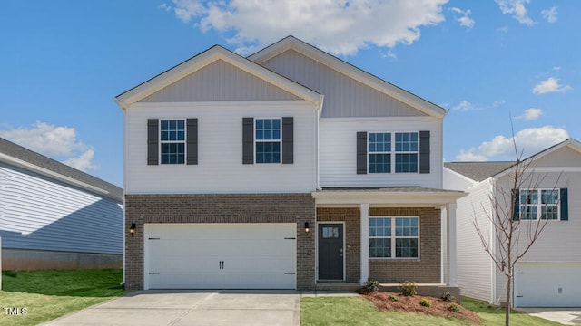 view of front of home featuring a garage and a front lawn