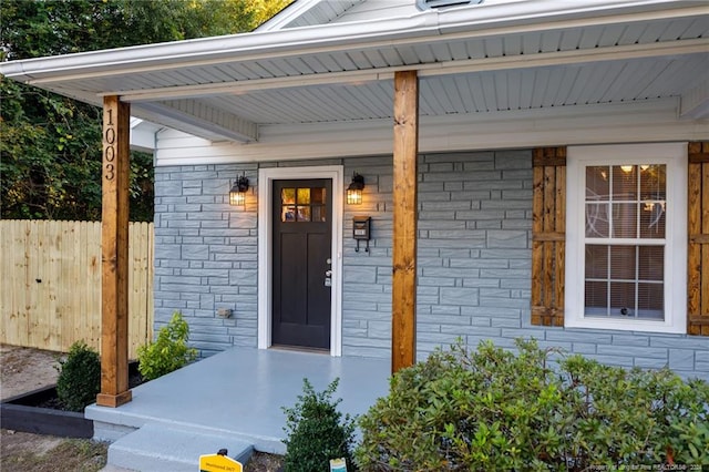 doorway to property with a porch