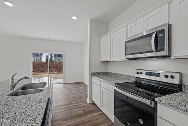 kitchen with white cabinetry, sink, and appliances with stainless steel finishes