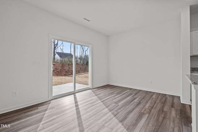 unfurnished dining area featuring light hardwood / wood-style floors