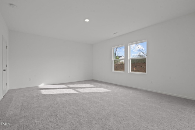 spare room with light carpet