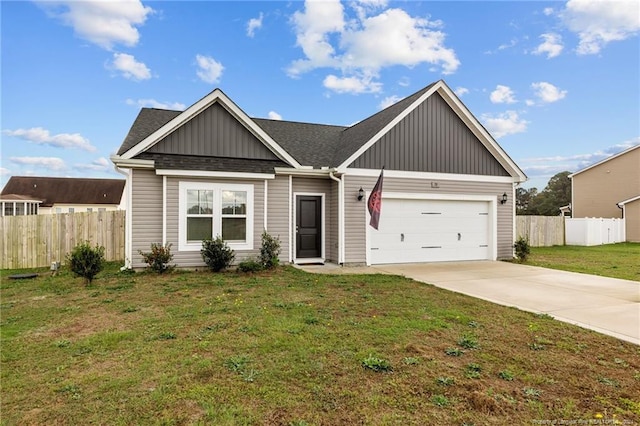 view of front of property with a garage and a front yard