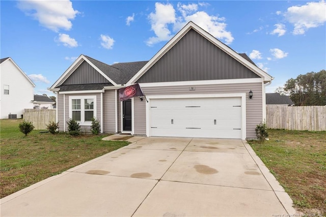 view of front facade with a garage and a front lawn