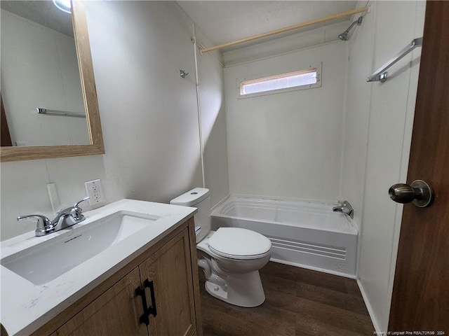 full bathroom featuring vanity, hardwood / wood-style flooring, toilet, and shower / bathtub combination