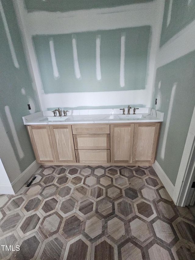 15 Independence Dr, Smithfield, NC 27577 - bathroom featuring baseboards and a sink