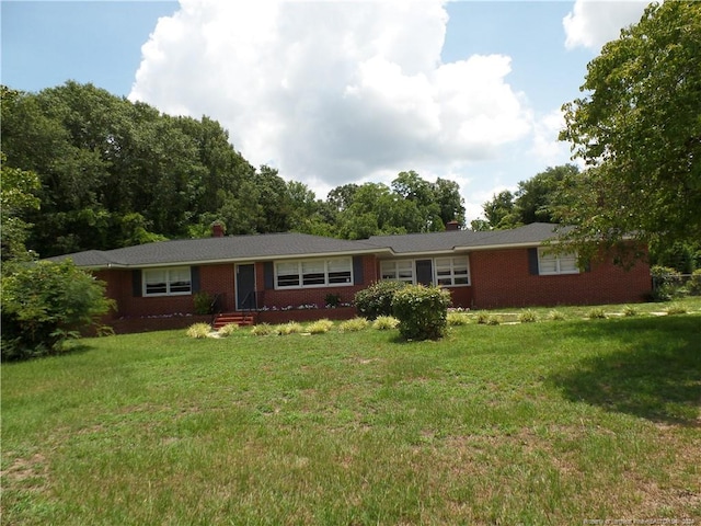 ranch-style house with a front lawn