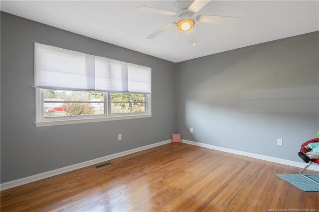 unfurnished room with light hardwood / wood-style flooring and ceiling fan