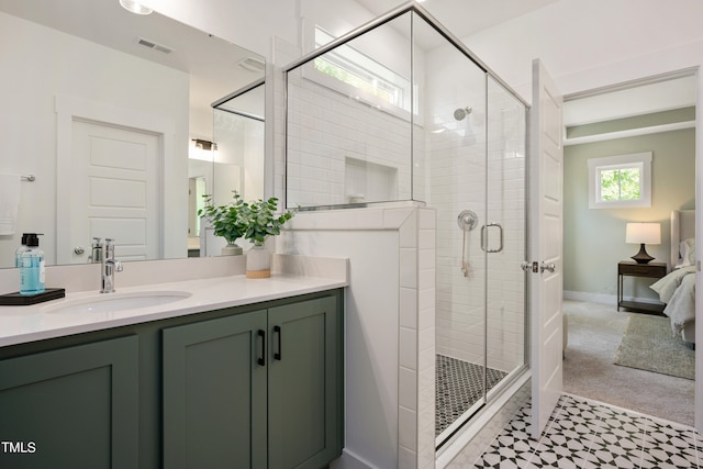 bathroom featuring vanity and a shower with door