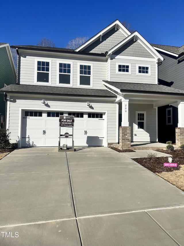 craftsman house featuring a garage and a porch