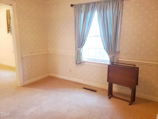 203 Green St, Fremont, NC 27830 - unfurnished room featuring wallpapered walls, carpet flooring, and baseboards