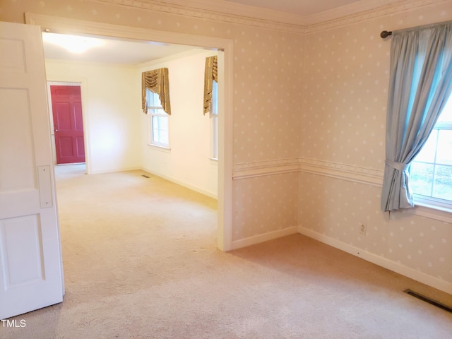 203 Green St, Fremont, NC 27830 - carpeted spare room with crown molding, healthy amount of natural light, wallpapered walls, and baseboards