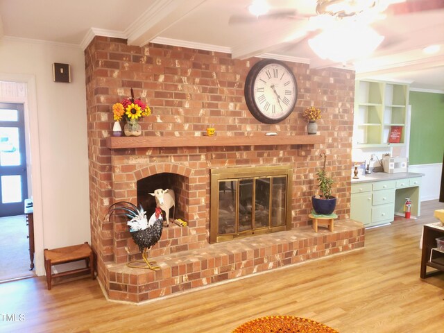 203 Green St, Fremont, NC 27830 - living room featuring a fireplace, wood finished floors, and crown molding
