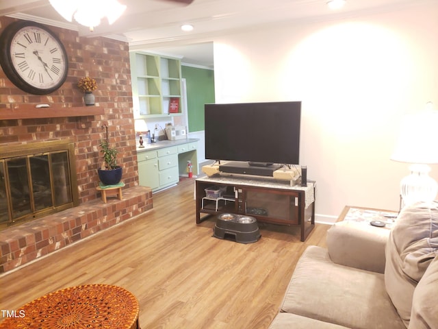 203 Green St, Fremont, NC 27830 - living area featuring light wood finished floors, ornamental molding, a fireplace, and ceiling fan
