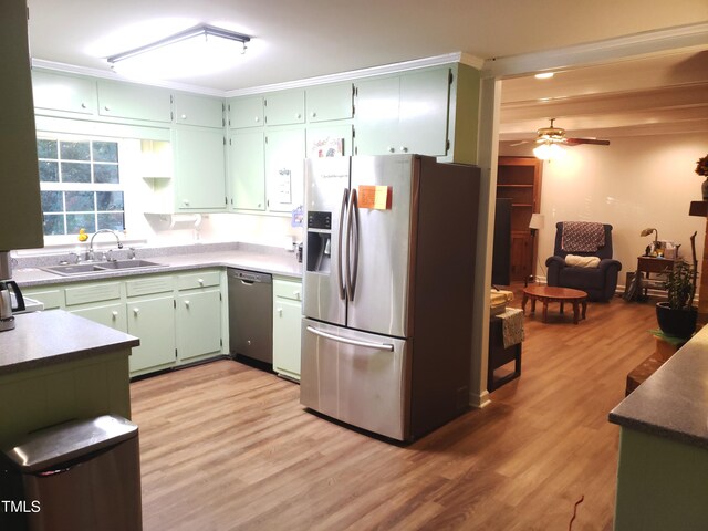 203 Green St, Fremont, NC 27830 - kitchen featuring appliances with stainless steel finishes, a sink, light wood finished floors, and a ceiling fan