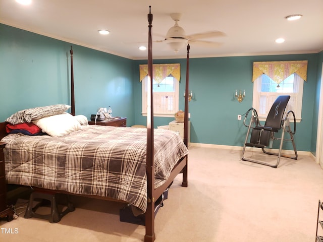 carpeted bedroom featuring ceiling fan and ornamental molding