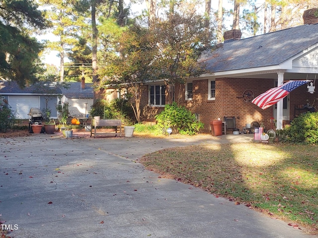 203 Green St, Fremont, NC 27830 - view of front facade featuring brick siding and a chimney