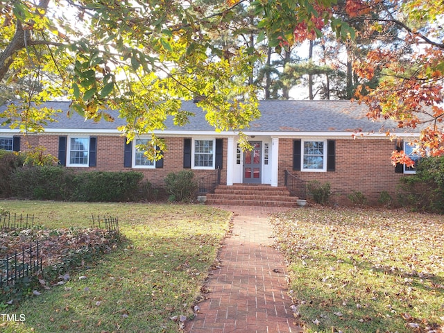 ranch-style house featuring a front lawn