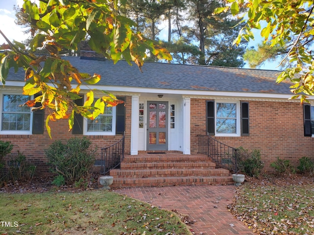 203 Green St, Fremont, NC 27830 - view of front of property with brick siding and roof with shingles