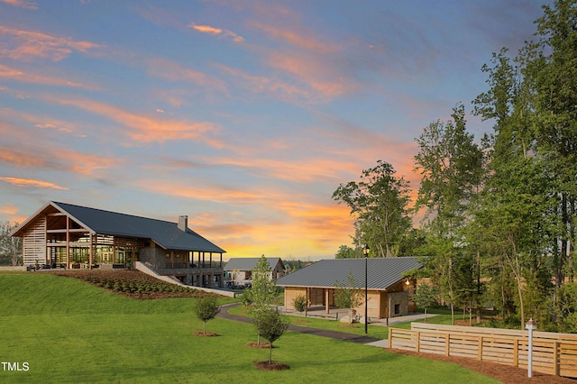 view of yard at dusk