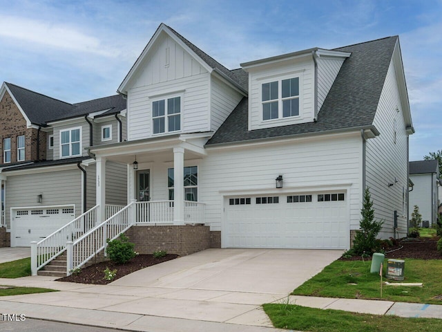 view of front of property featuring a porch and a garage