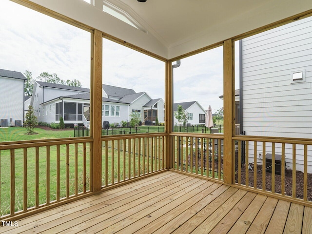 wooden terrace featuring a yard