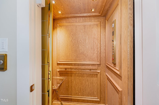 interior details with elevator and wood ceiling