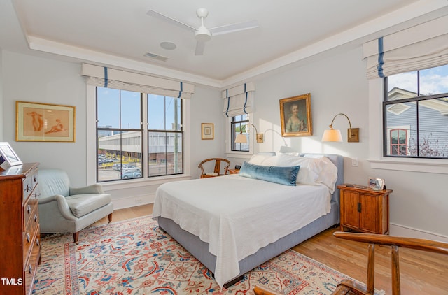 bedroom featuring ceiling fan and light hardwood / wood-style floors