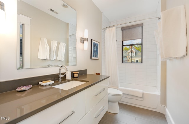 full bathroom with shower / bath combination with curtain, toilet, and vanity