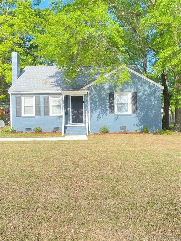 110 N Grove Ave, Rockingham, NC 28379 - bungalow-style home with a front lawn and a chimney