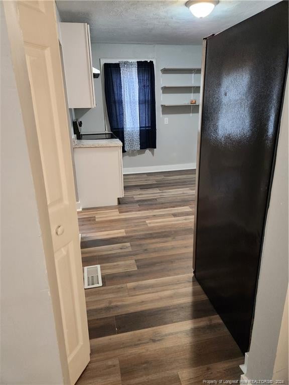 110 N Grove Ave, Rockingham, NC 28379 - hallway featuring wood finished floors and baseboards