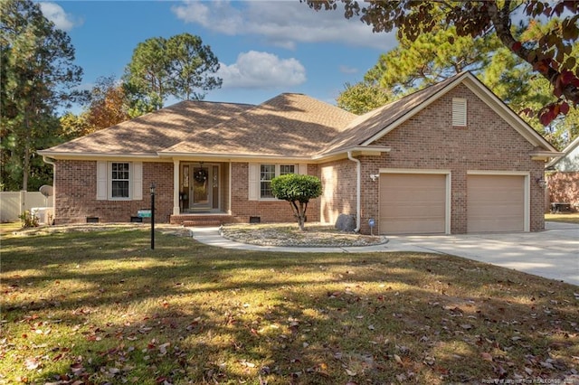 single story home with a garage and a front lawn