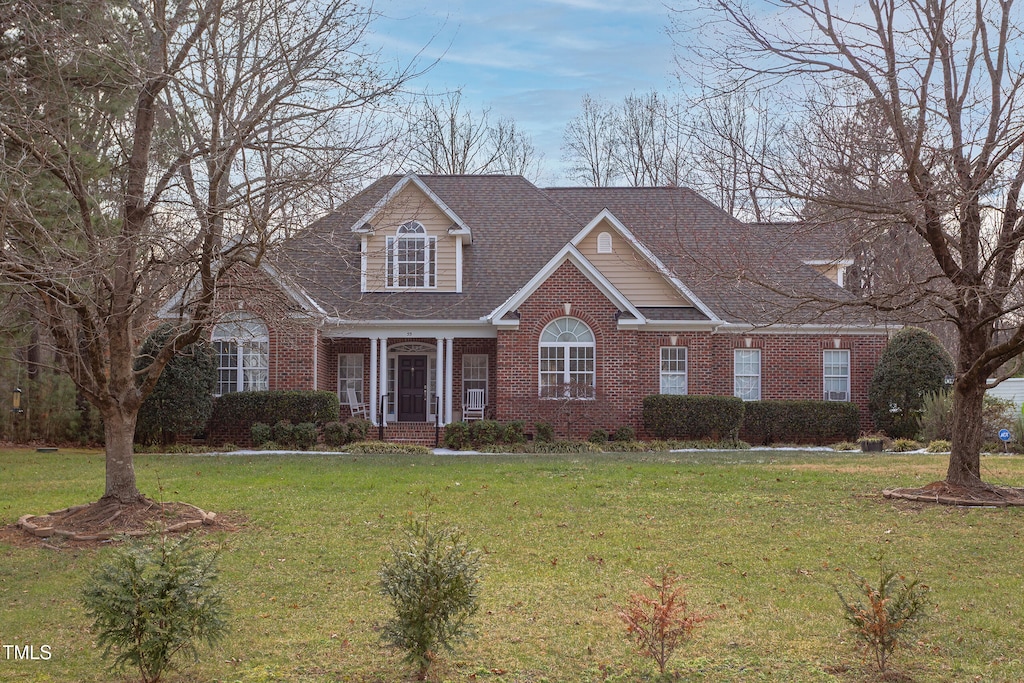 view of front of property with a front lawn