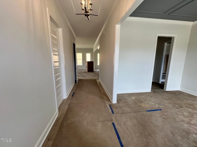 6044 Scalybark Rd, Durham, NC 27712 - corridor featuring ornamental molding, a chandelier, and baseboards