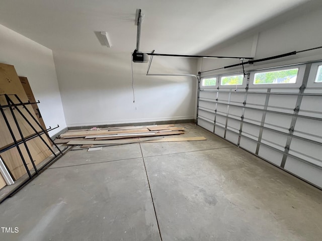 6044 Scalybark Rd, Durham, NC 27712 - garage with a garage door opener and baseboards