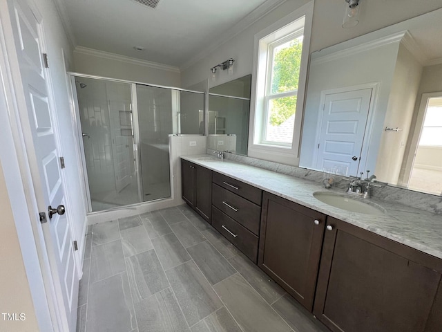6044 Scalybark Rd, Durham, NC 27712 - bathroom with crown molding, plenty of natural light, a shower stall, and double vanity