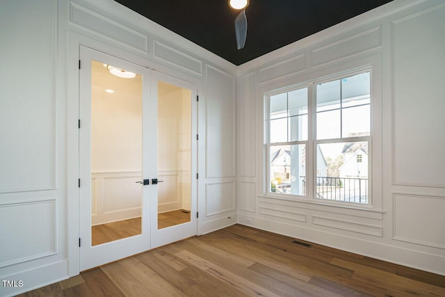 interior space with light hardwood / wood-style floors and french doors