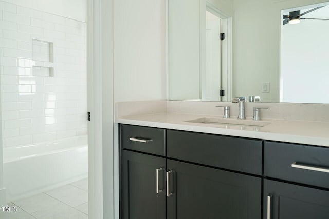 bathroom with tile patterned flooring, vanity, ceiling fan, and  shower combination