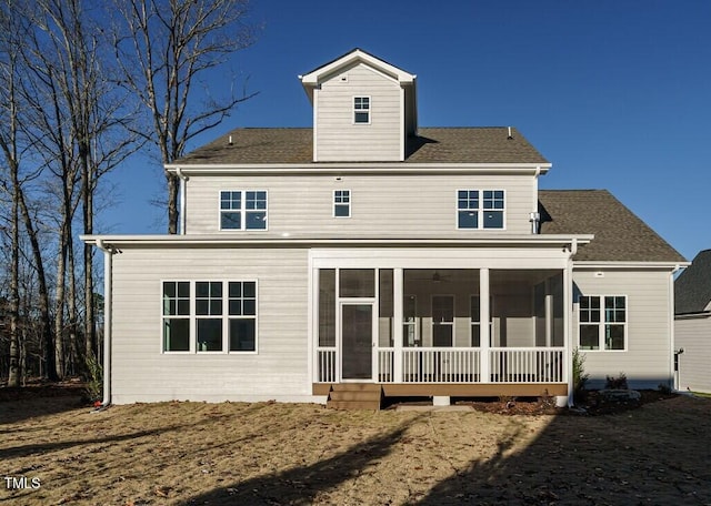 back of house featuring a sunroom