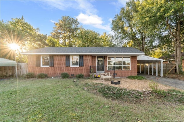 ranch-style home with a carport and a front lawn