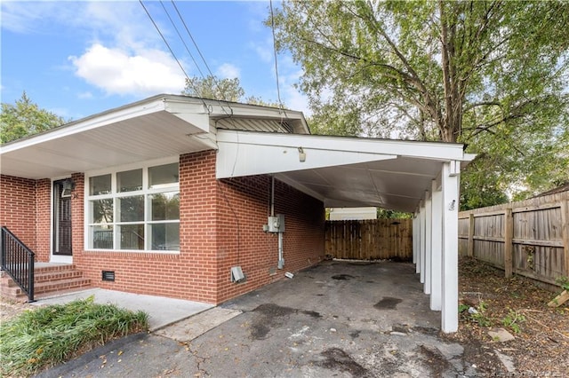 view of property exterior with a carport