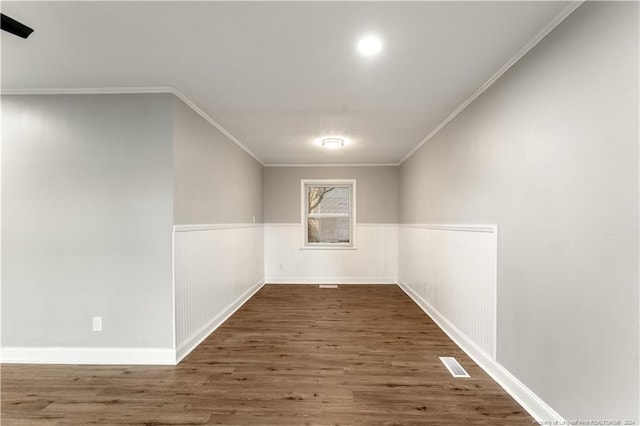 interior space with dark hardwood / wood-style floors and crown molding