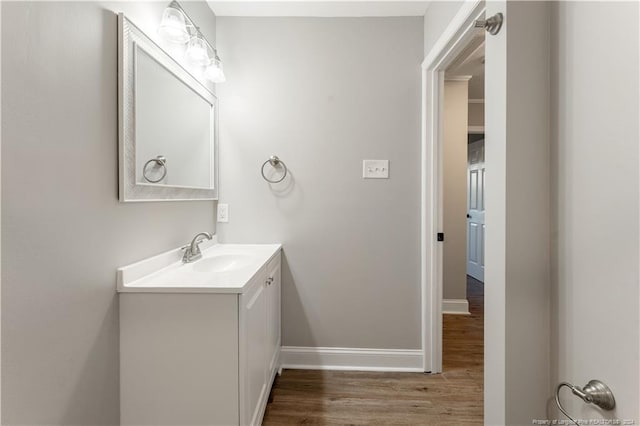 bathroom with wood-type flooring and vanity