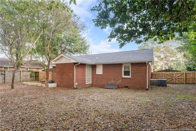 rear view of property featuring central AC