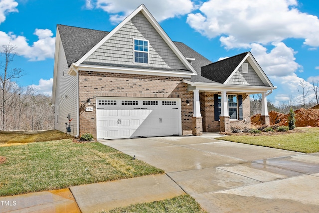 craftsman house with a garage and a front yard