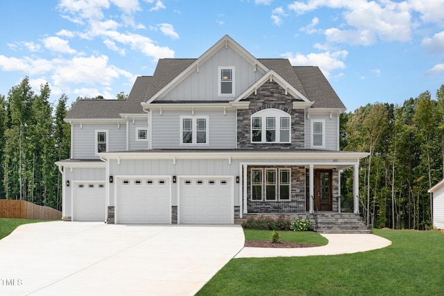 craftsman-style house featuring a front lawn, a porch, and a garage