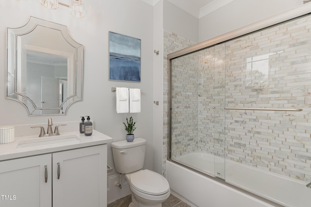 full bathroom featuring shower / bath combination with glass door, vanity, and toilet