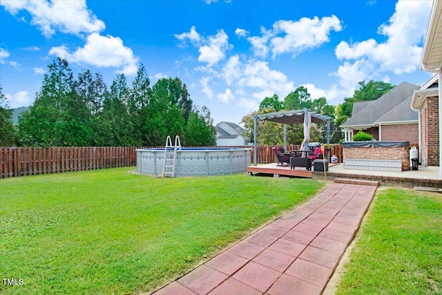 view of yard featuring a swimming pool side deck and a pergola