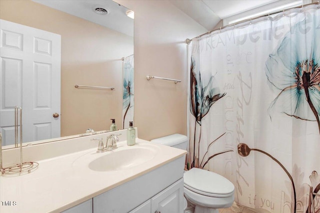 bathroom with vanity, toilet, walk in shower, and lofted ceiling